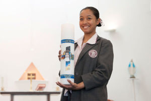 Mary MacKillop Catholic College Wakeley student holding school candle